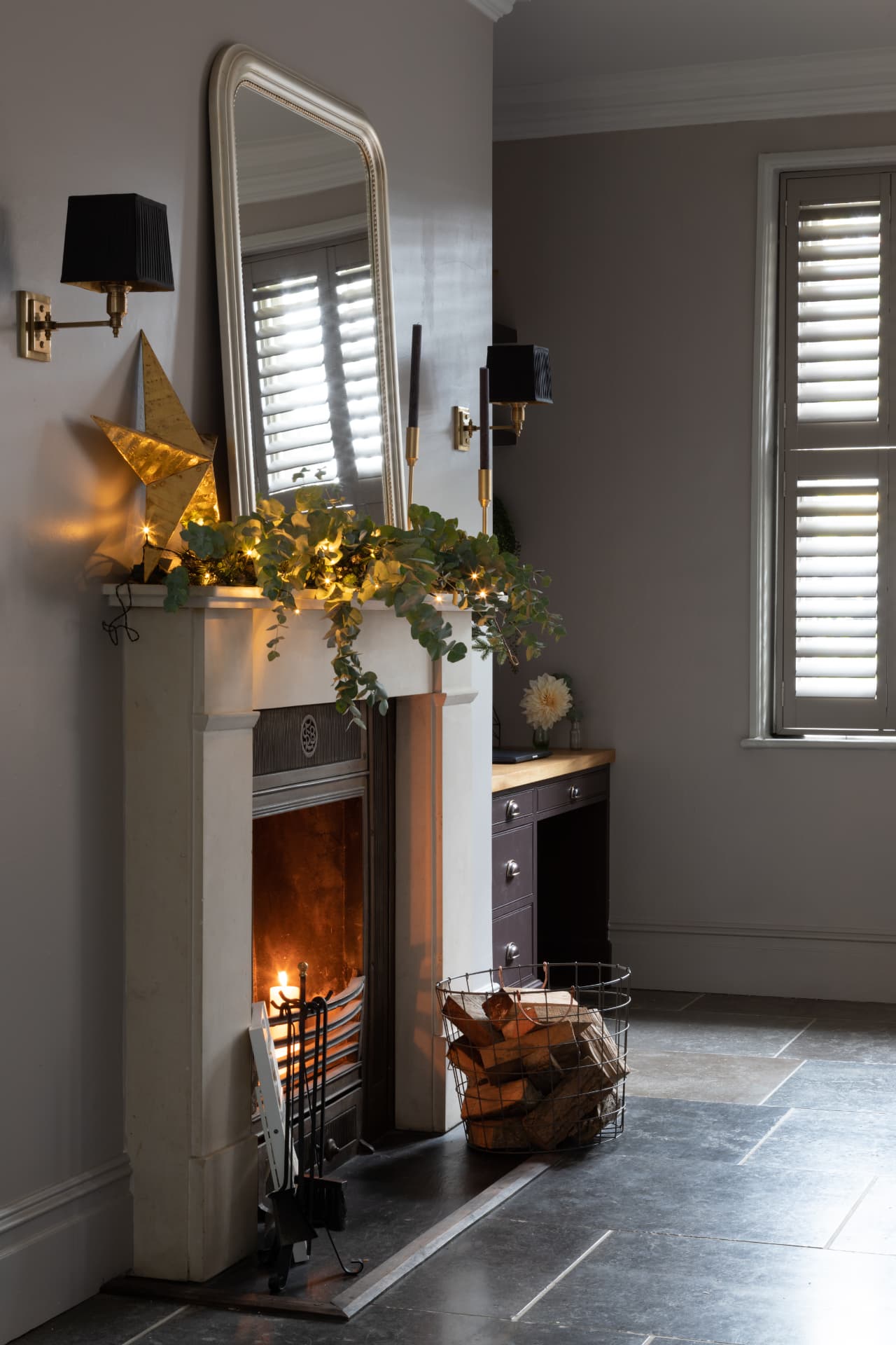 Stone coloured tier-on-tier shutters in a living room at Christmas