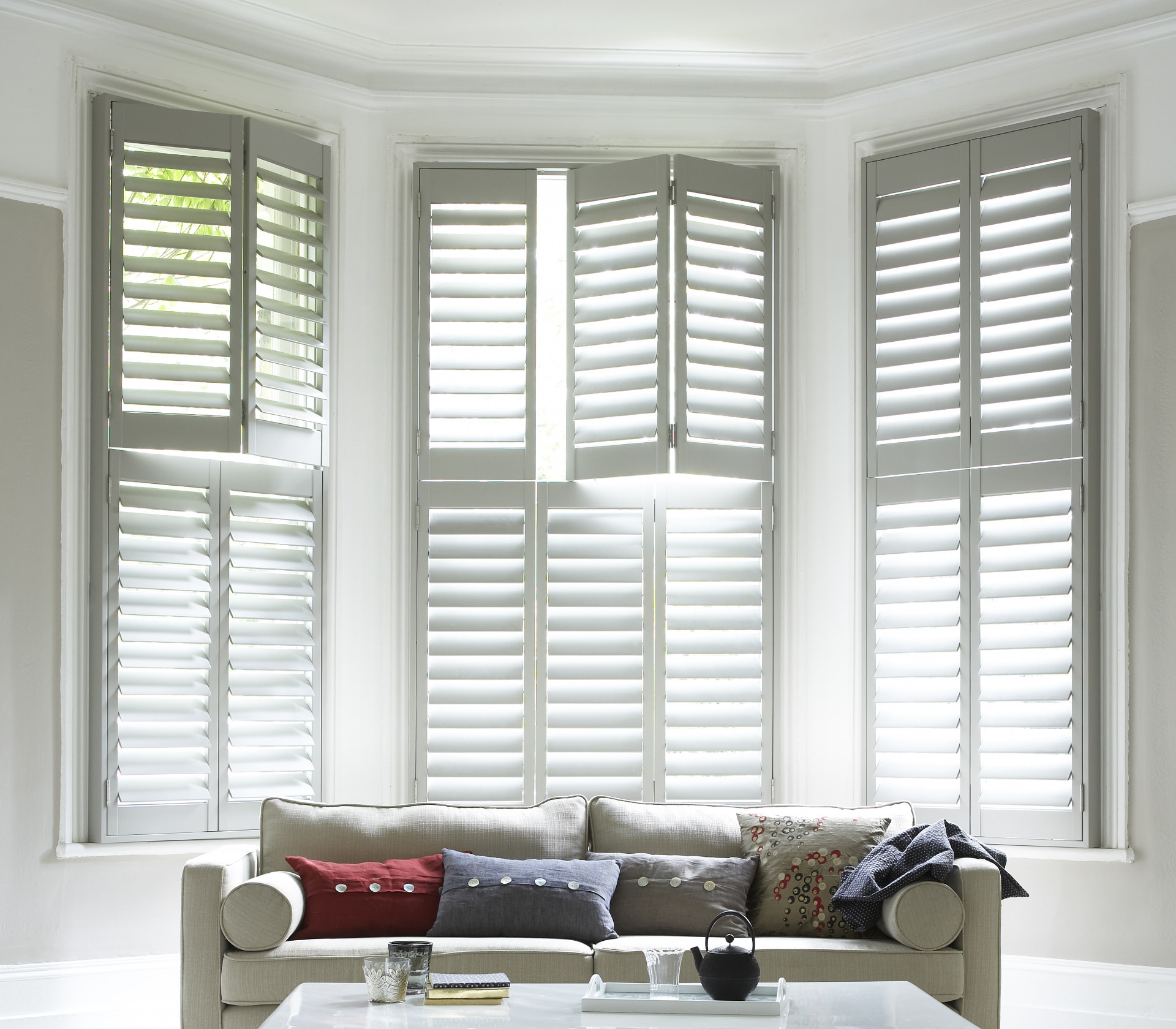 Tier-on-tier shutters seen straight on in a period lounge