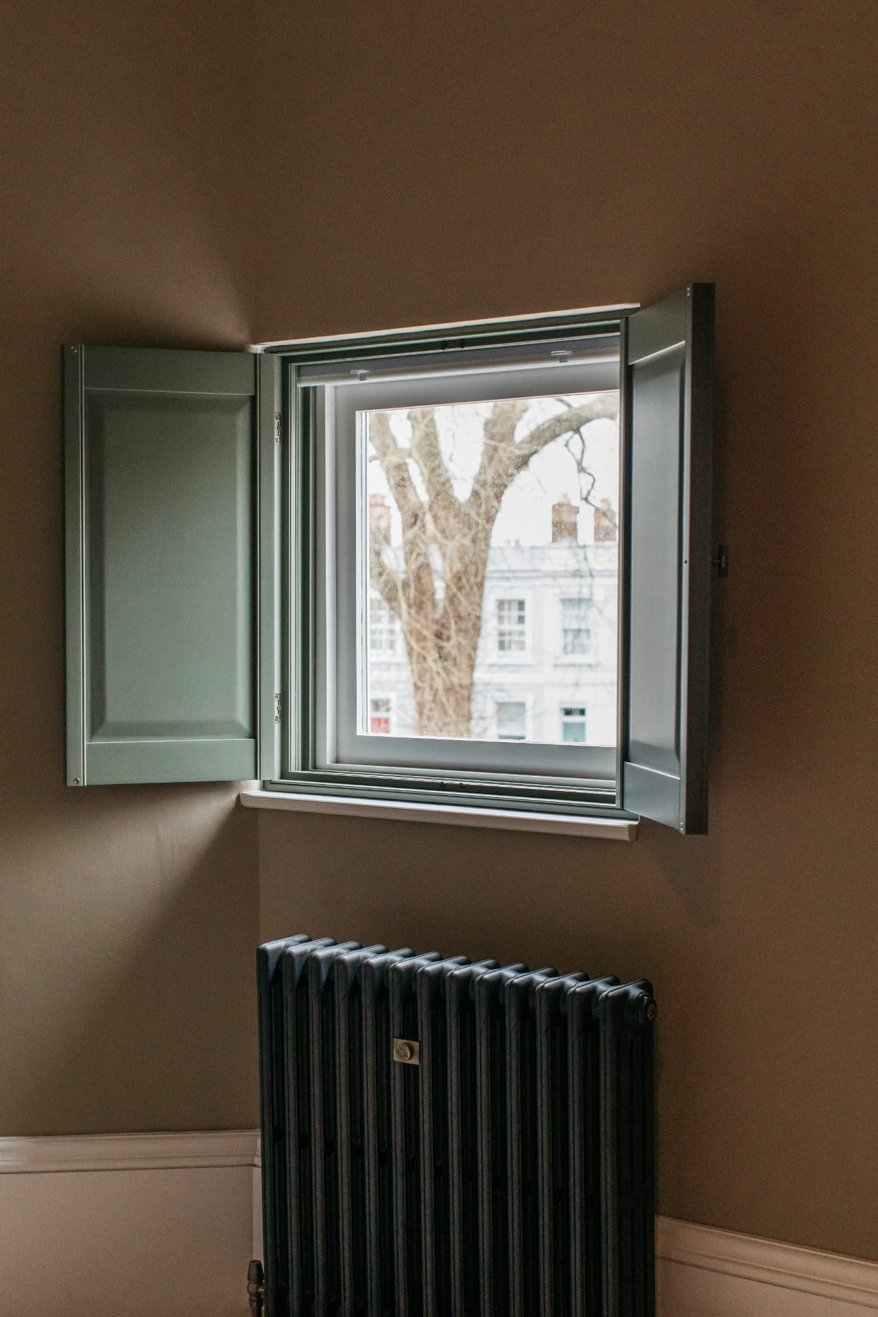 Solid raised shutter panels open with the blind up