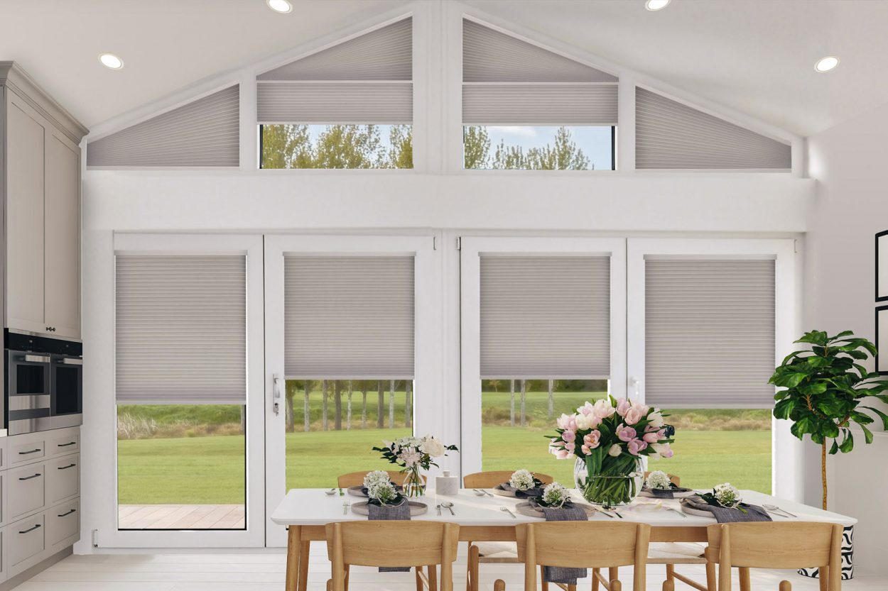 Pleated blinds fitted across apex glazing in a kitchen diner